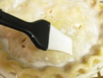 brush top pie crust with cream